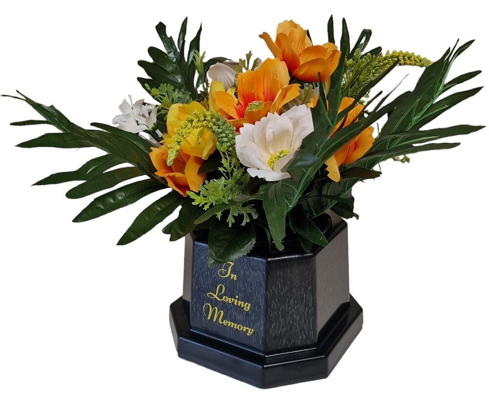 Artificial Cosmos and Astilbe flowers in a grave pot