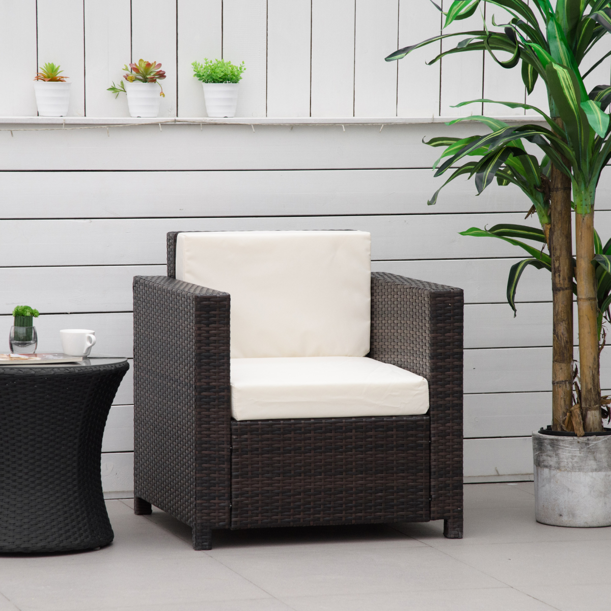 photo of rattan single sofa chair garden wicker weave armchair fire resistant brown on display
