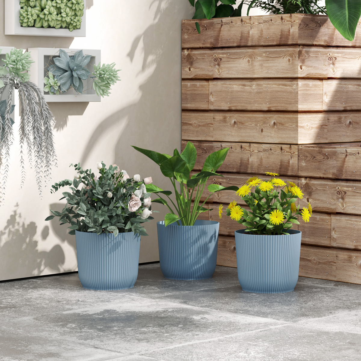 lifestyle shot of plant pots outdoor 22cm for garden decoration, blue
