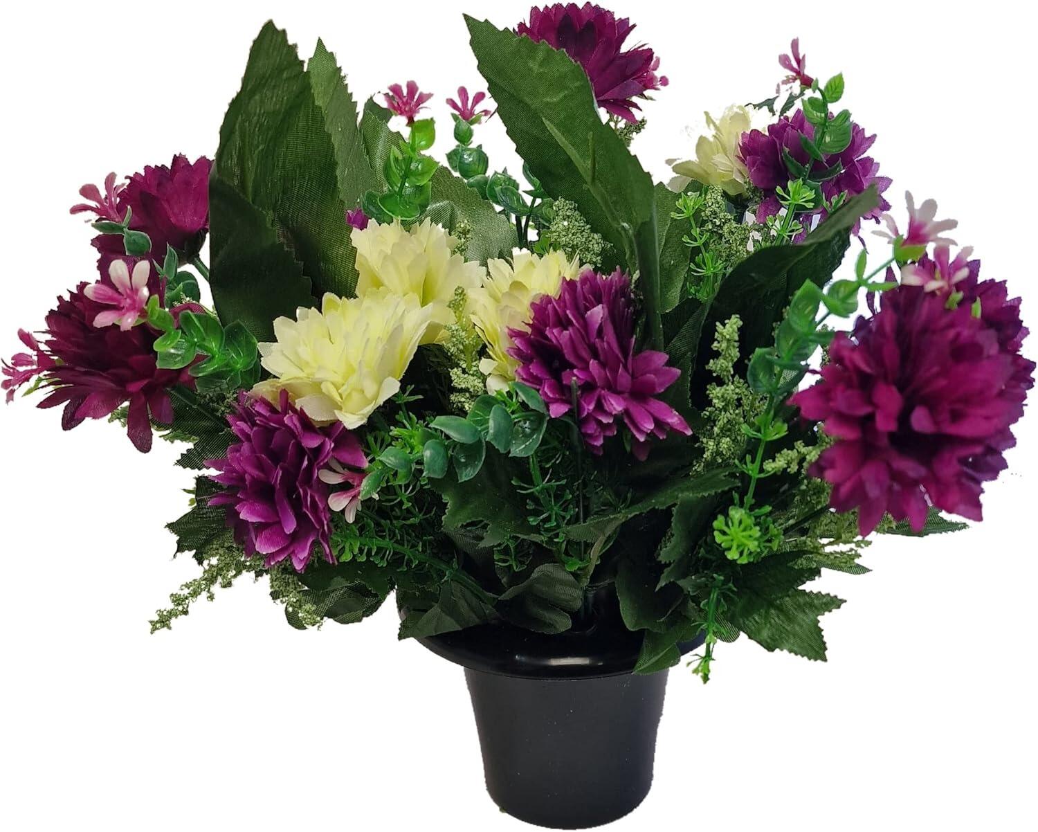 grave pot with purple artificial flowers