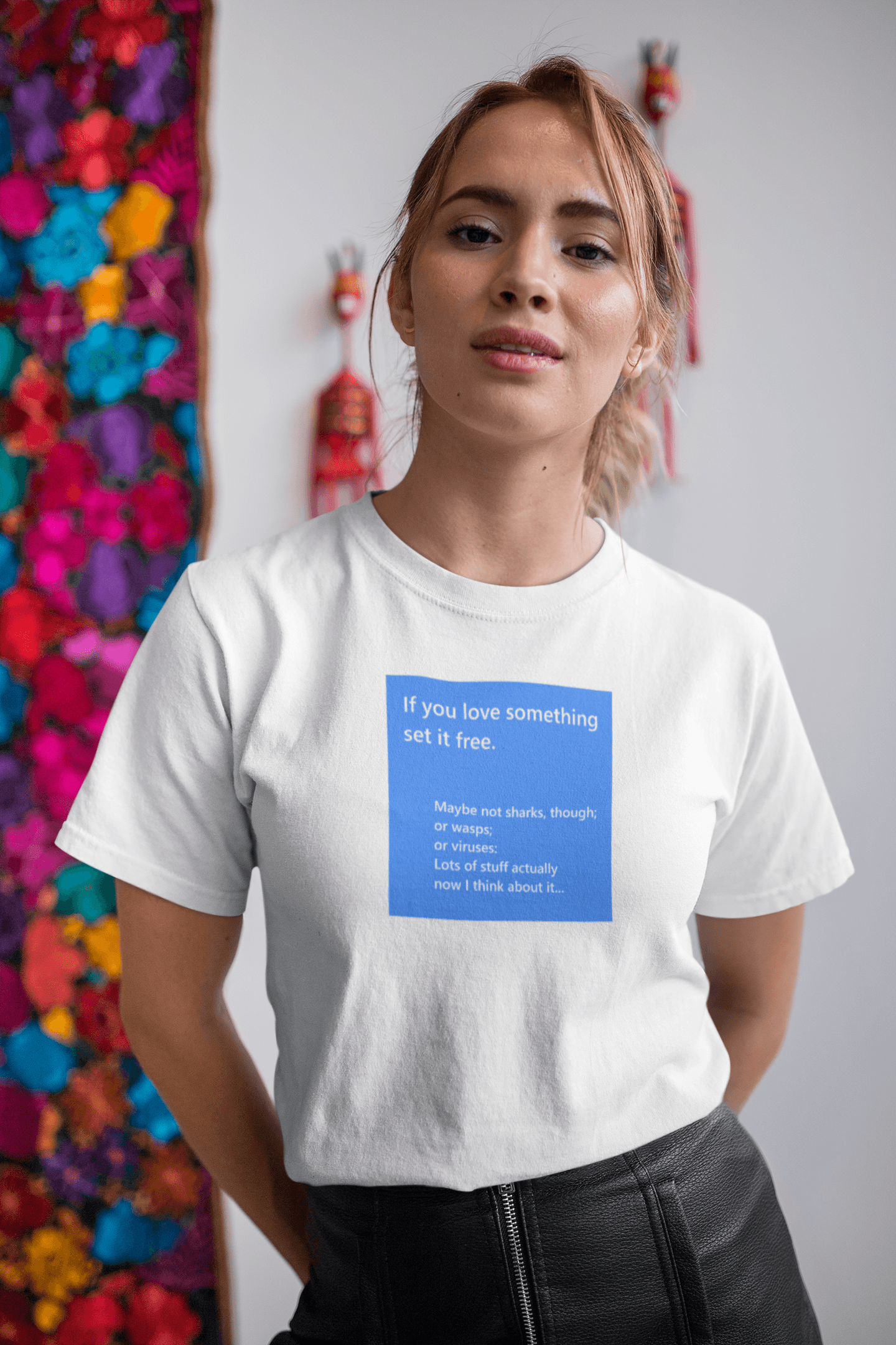 young blonde woman wearing a slogan t-shirt