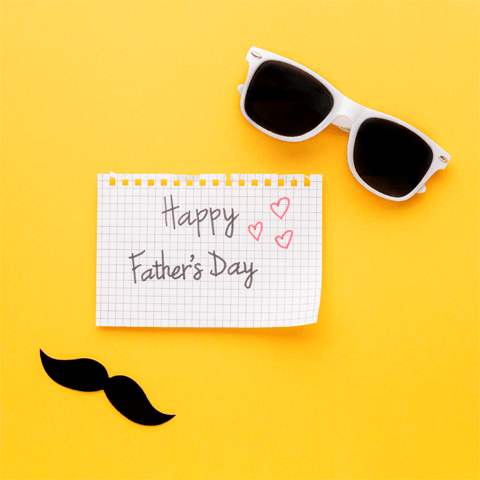 happy father's day message with sunglasses on yellow background