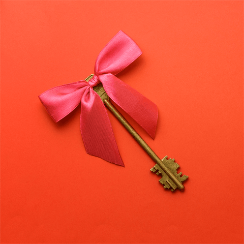 large key with red ribbon
