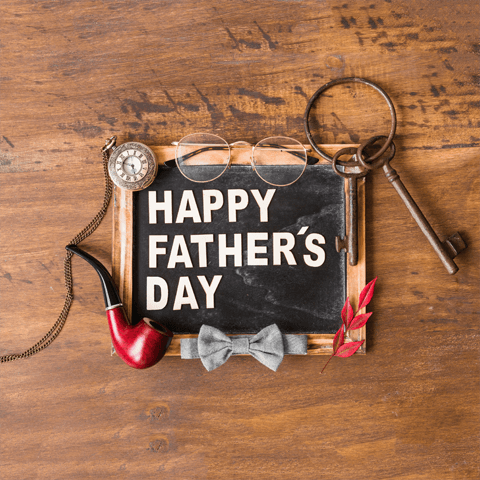 happy father's day picture blackboard and asorted items