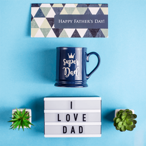 happy father's day message with blue mug and present