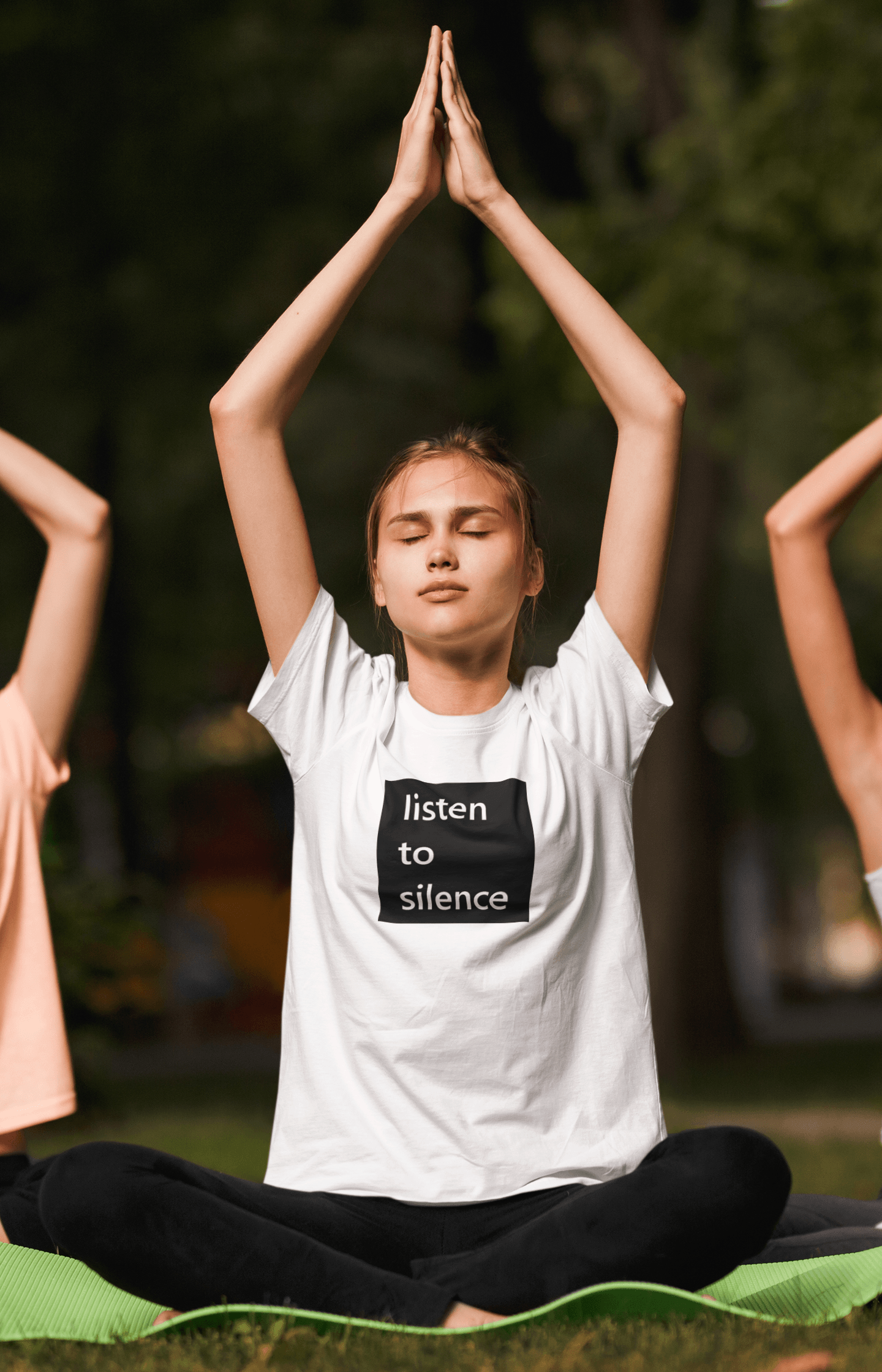 young woman doing yoga wearing a slogan t-shirt