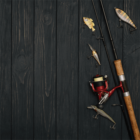 fishing rod and accessories on a wooden floor