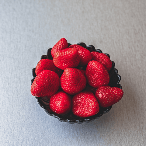 a bowl of juicy strawberries