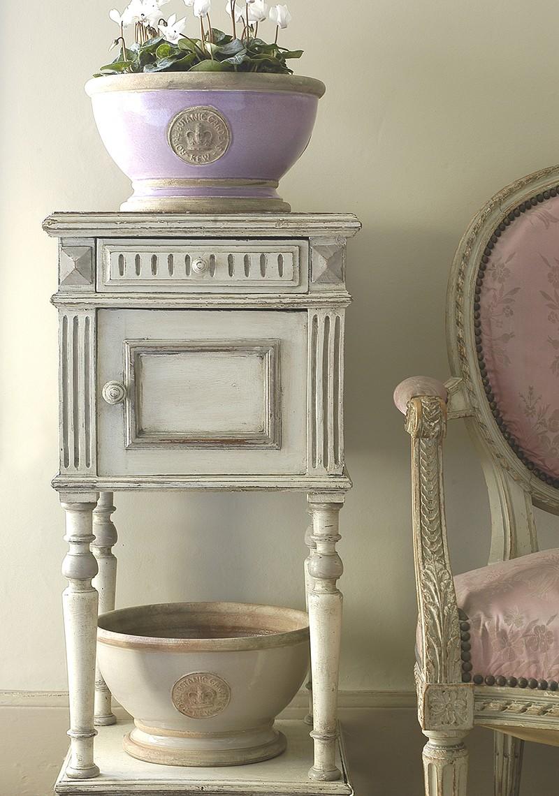 Cream vintage washstand with a Lavender colour glazed footed bowl on top and a second Almond colour footed bowl on the bottom shelf.