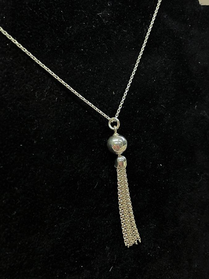 SILVER COLOURED BALL AND TASSEL PENDENT ON SILVER COLOURED CHAIN02-03-2021 at 09.47.07 2.JPG