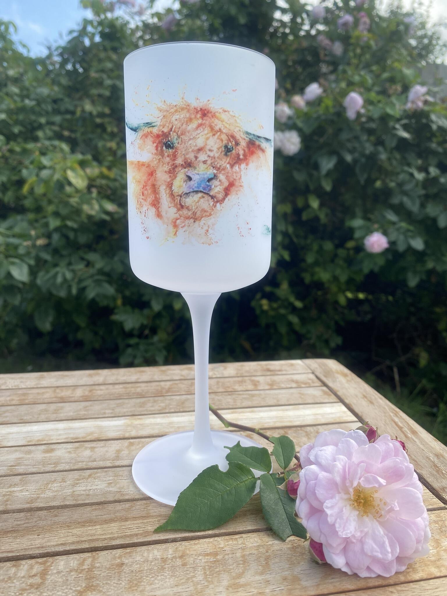 angus the cow on a wine glass