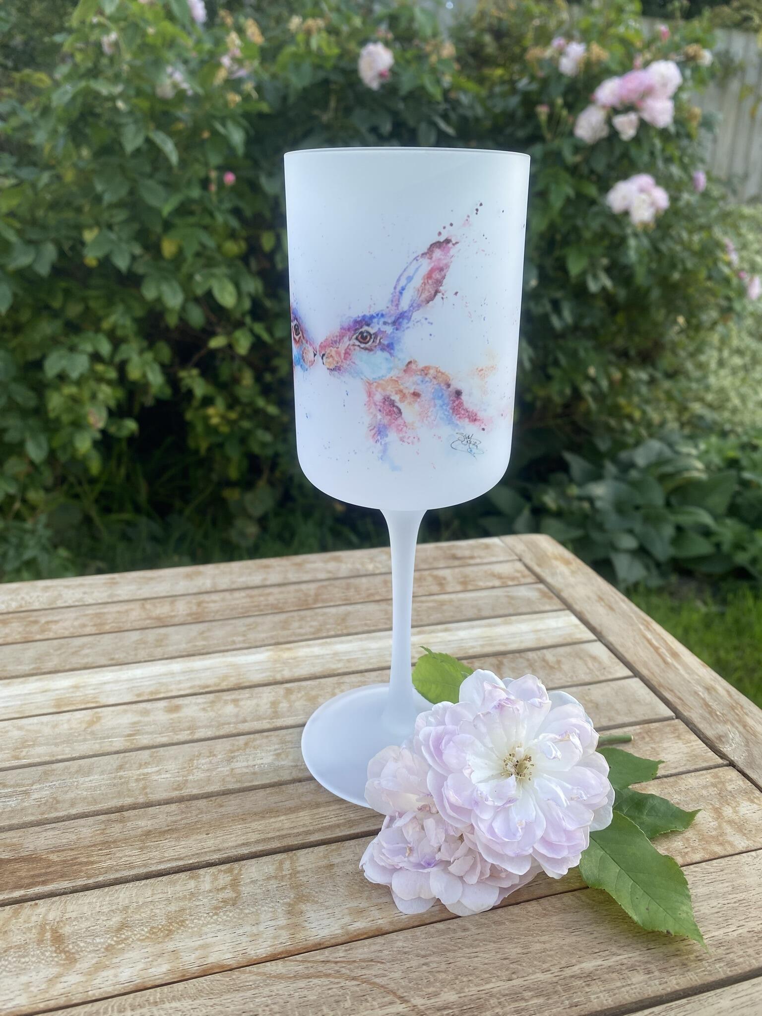 2 hares on a wine glass