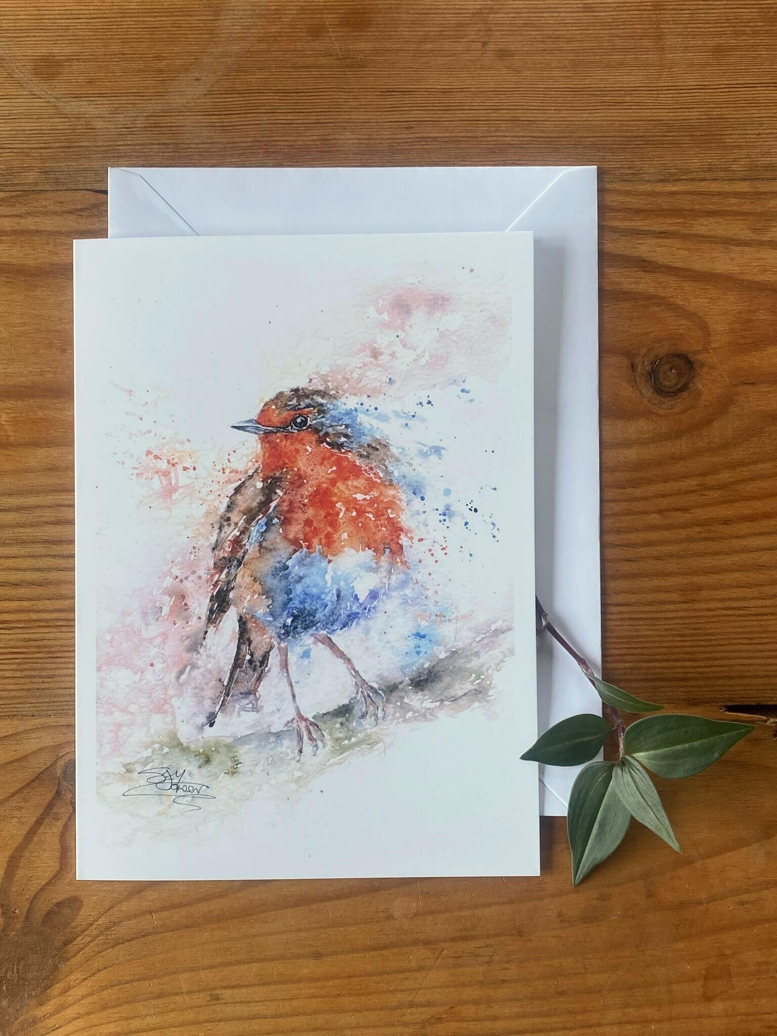 watercolour painting of a robin on an A5 card