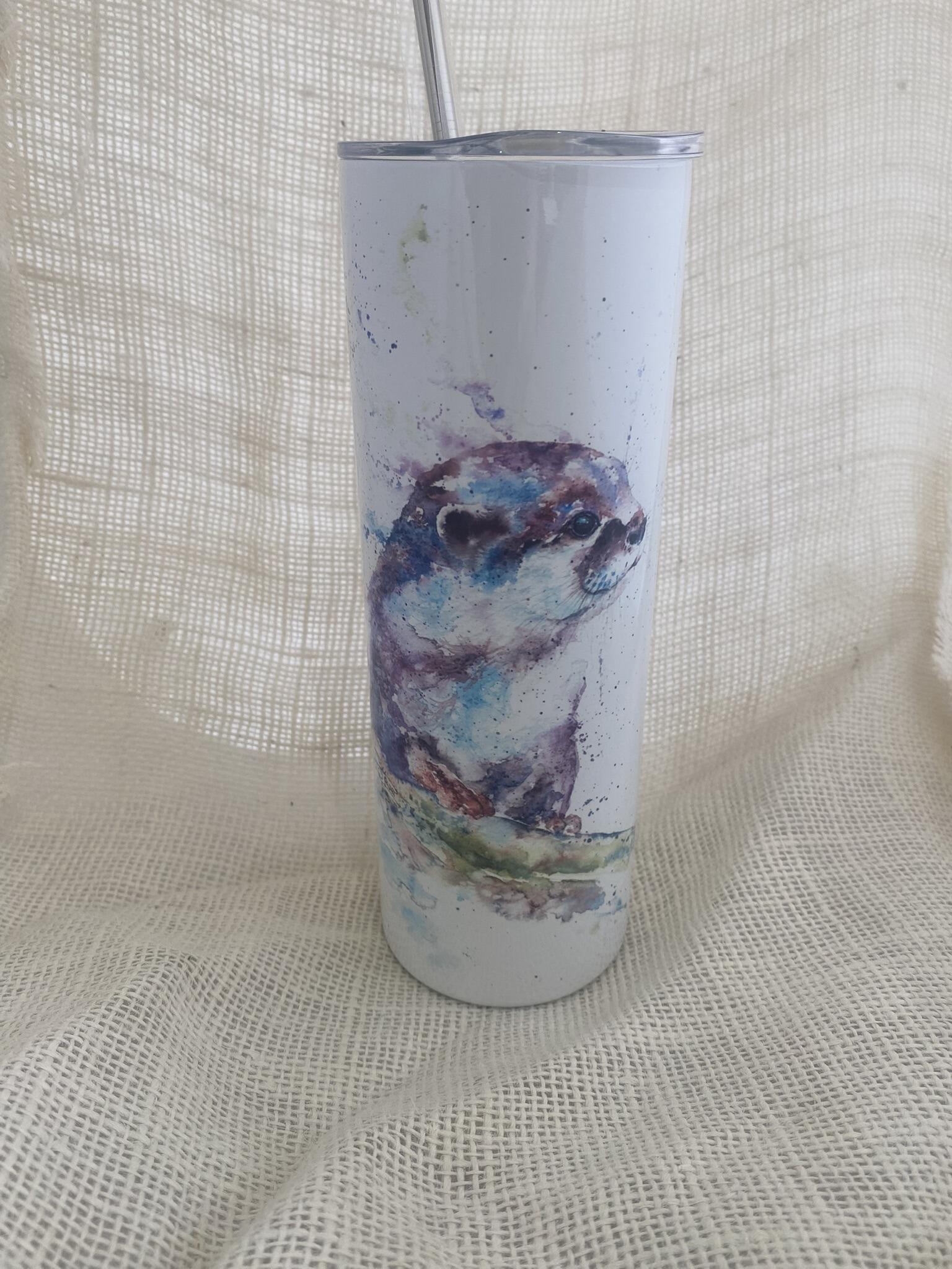 otter design on a steel drinks cup