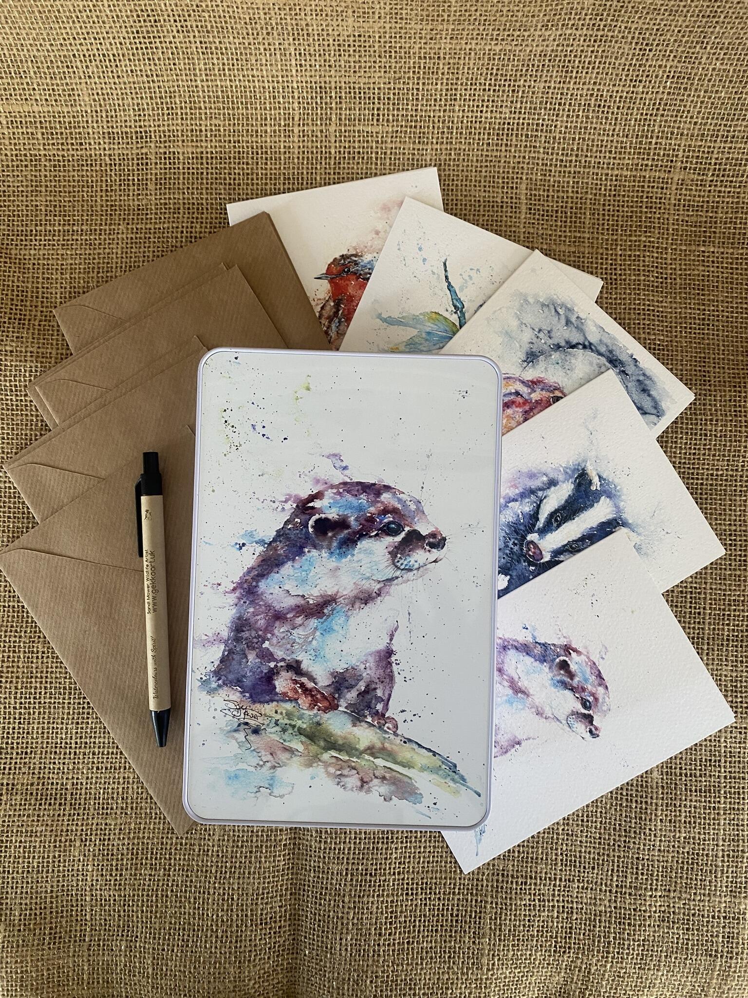 otter tin with cards