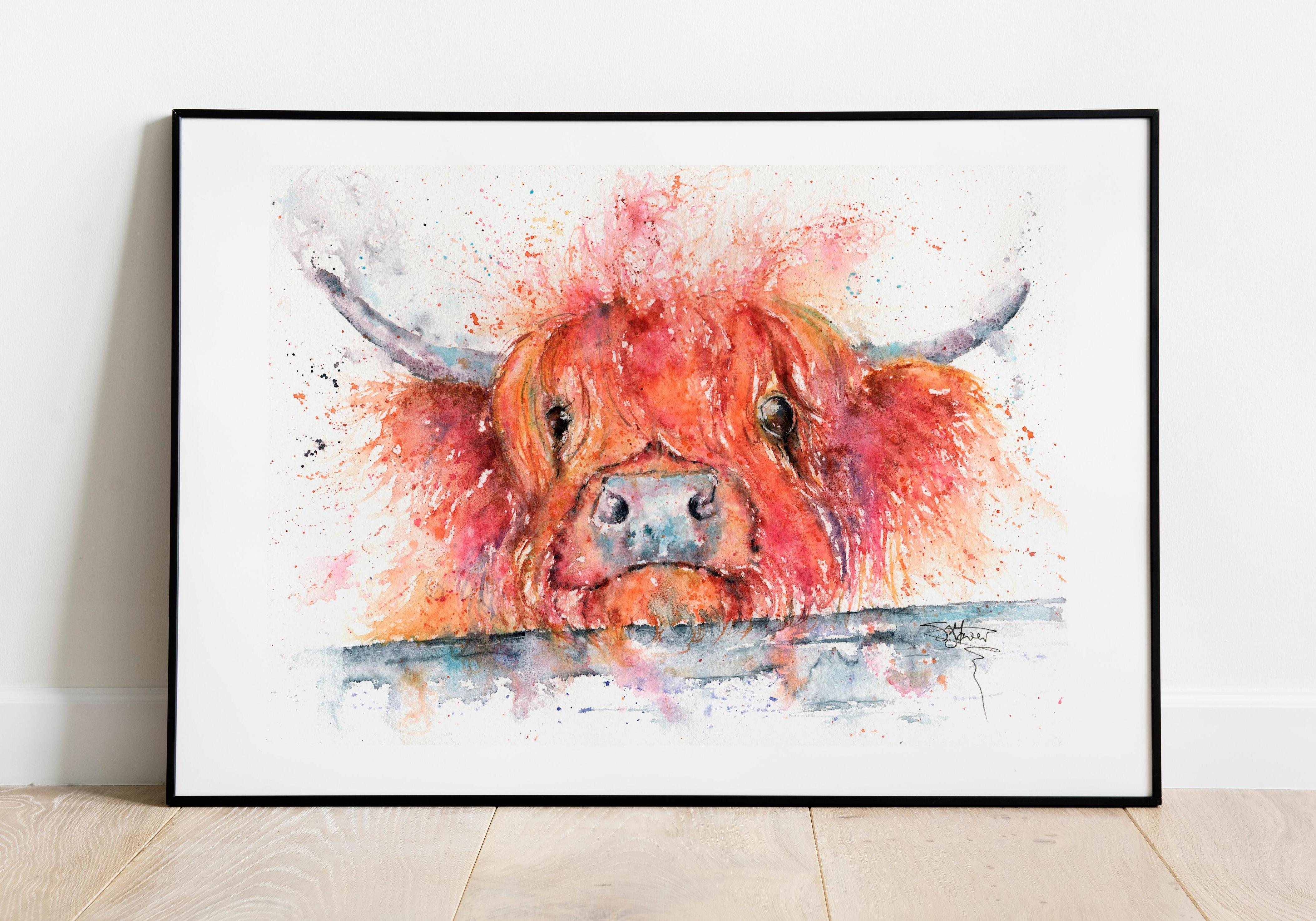 highland cow watercolour in a black frame