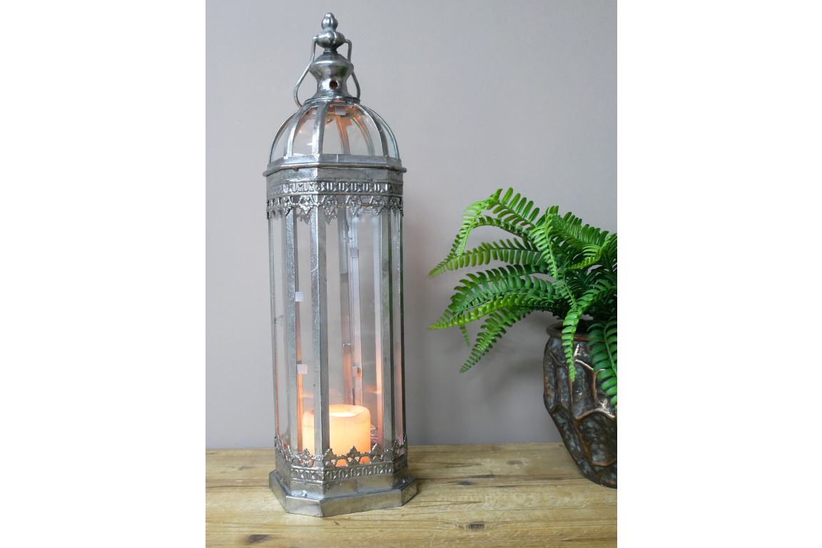 A Tall Silver Metal Glazed Candle Lantern