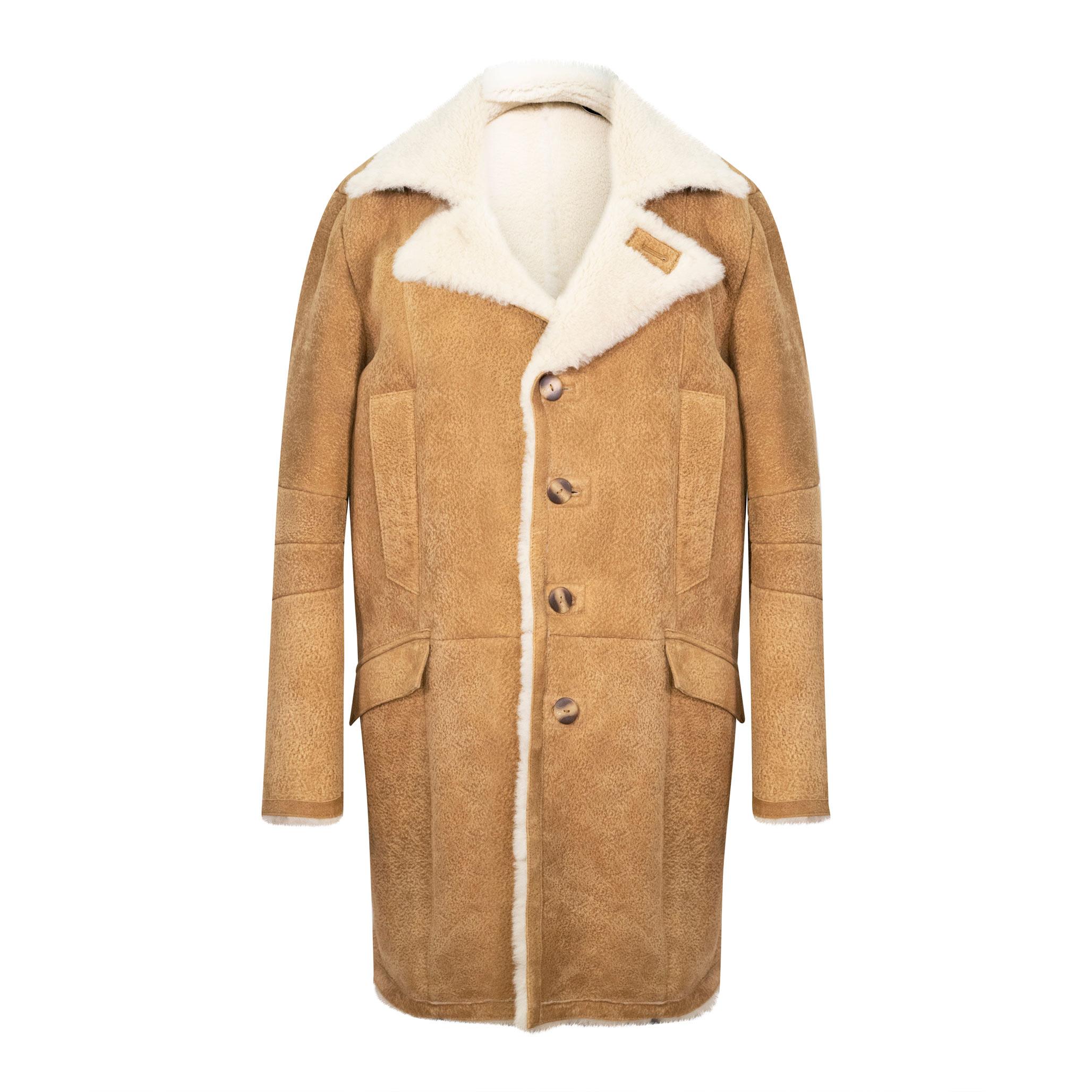 A thick sheepskin coat in tan with cream fur. Long length, with front buttoned fastening. 4 external hand warmer pockets.