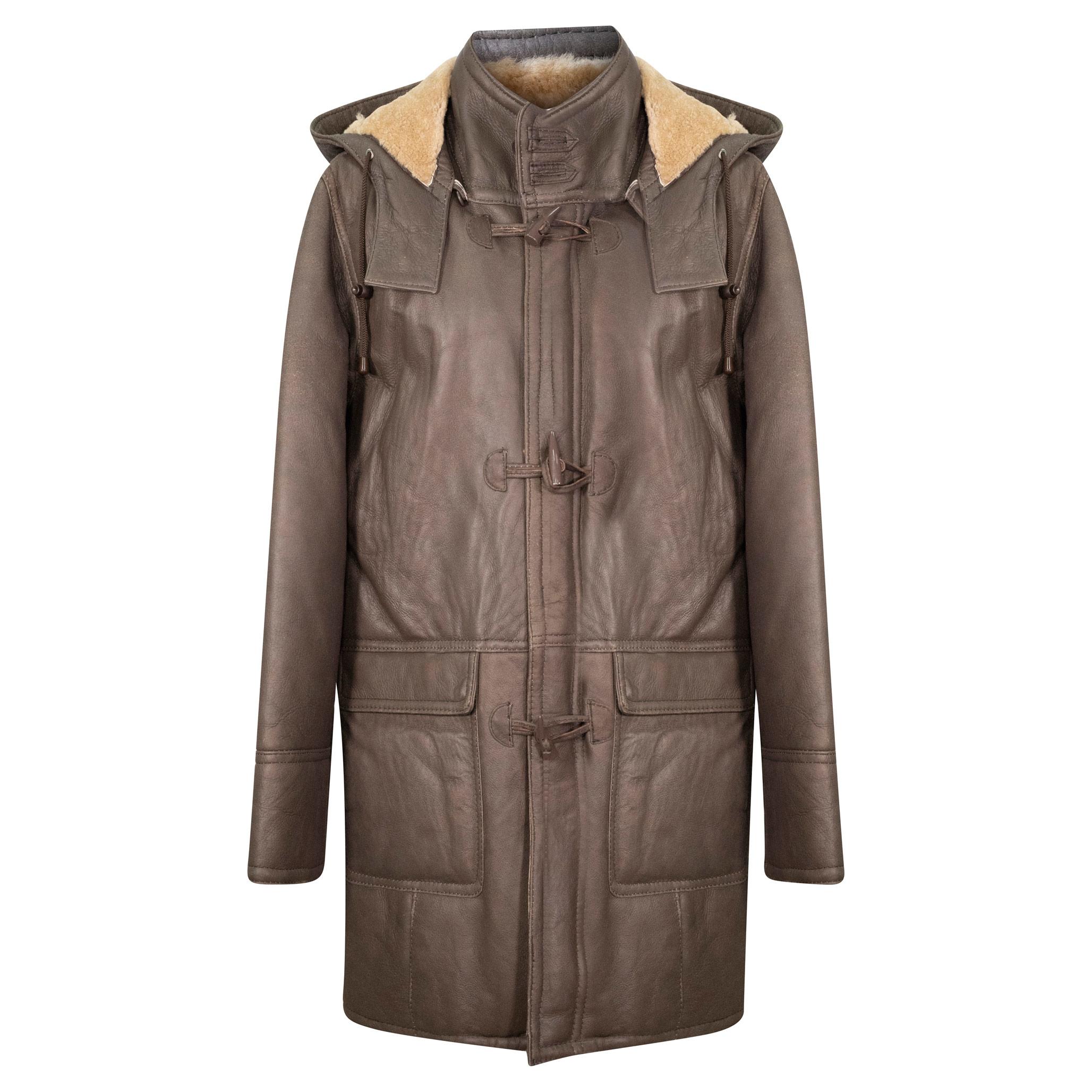 A long brown sheepskin duffle coat, with a hood. There is a zip fastening, overlapped with toggle fastening.