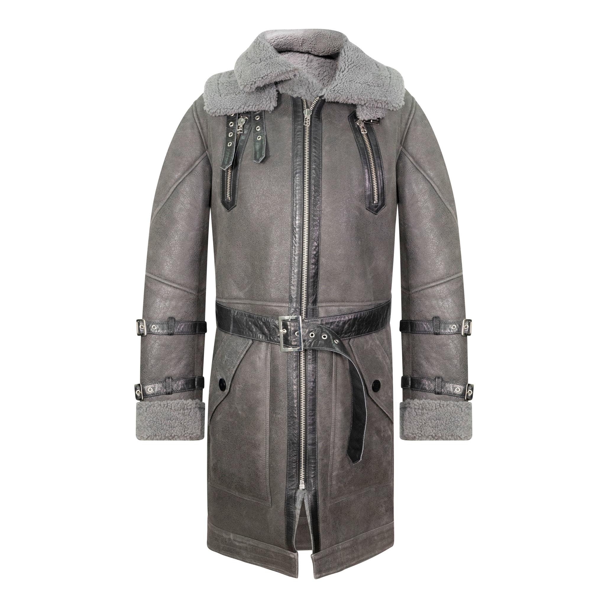 An beautiful long grey sheepskin trench coat, with a black front fastening belt, and collar buckles, and a chunky front zip fastening.