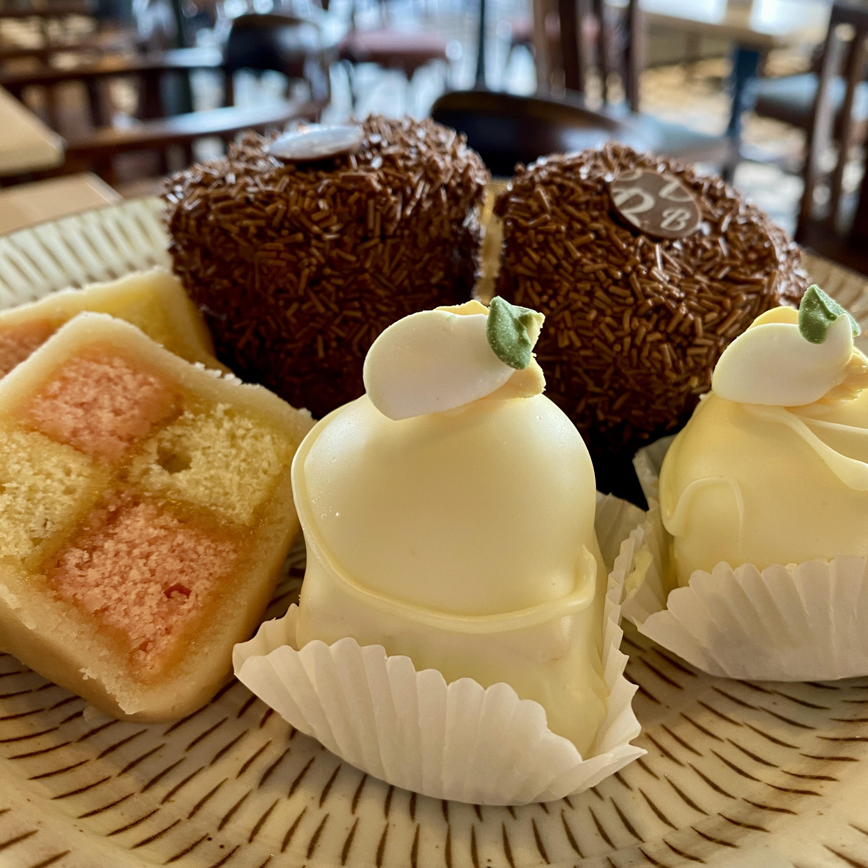 Top tier mini-fancy cake selection, including Fondant Fancy, Chocolate Japonaise and Battenburg. This is the top tier of Botham's Traditional Afternoon Tea served in the Tea Rooms.