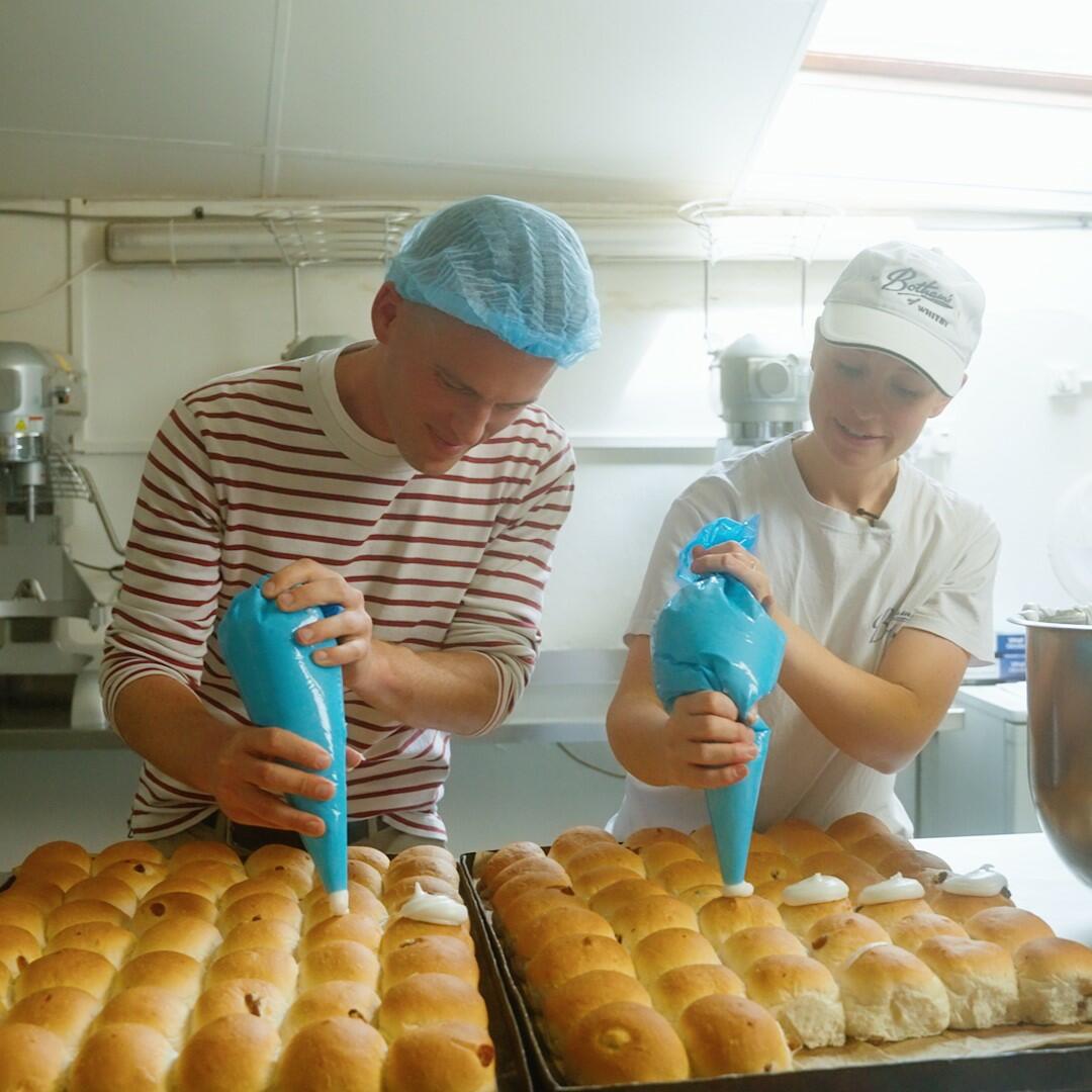 Family baker Lois with former GBBO Winner & local lad, David Atherton, piping Whitby Lemon Buns during filming for North York Moors Capital of Cake.