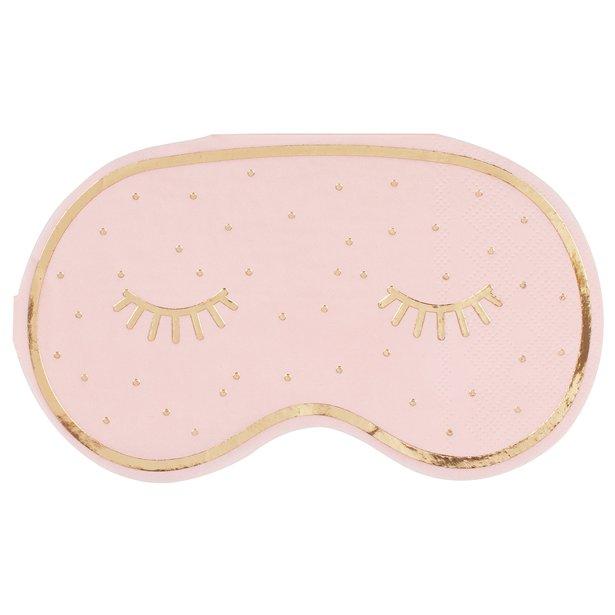 A pale pink eye mask shaped napkin with gold eyelashes on