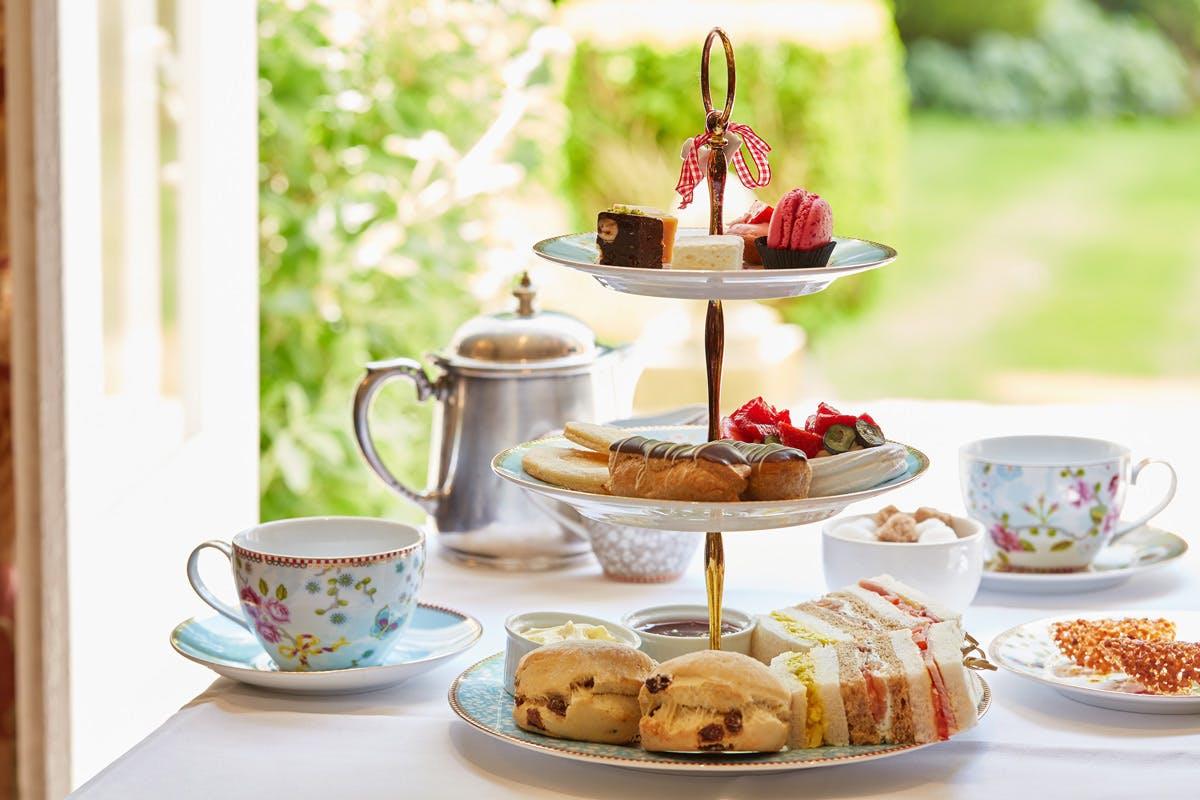 Champagne Afternoon Tea For Two At The Luxury Ockenden Manor Hotel & Indulge In A Quintessentially British Tradition