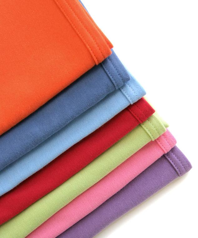 Organic cotton baby blanket colour range in a pile