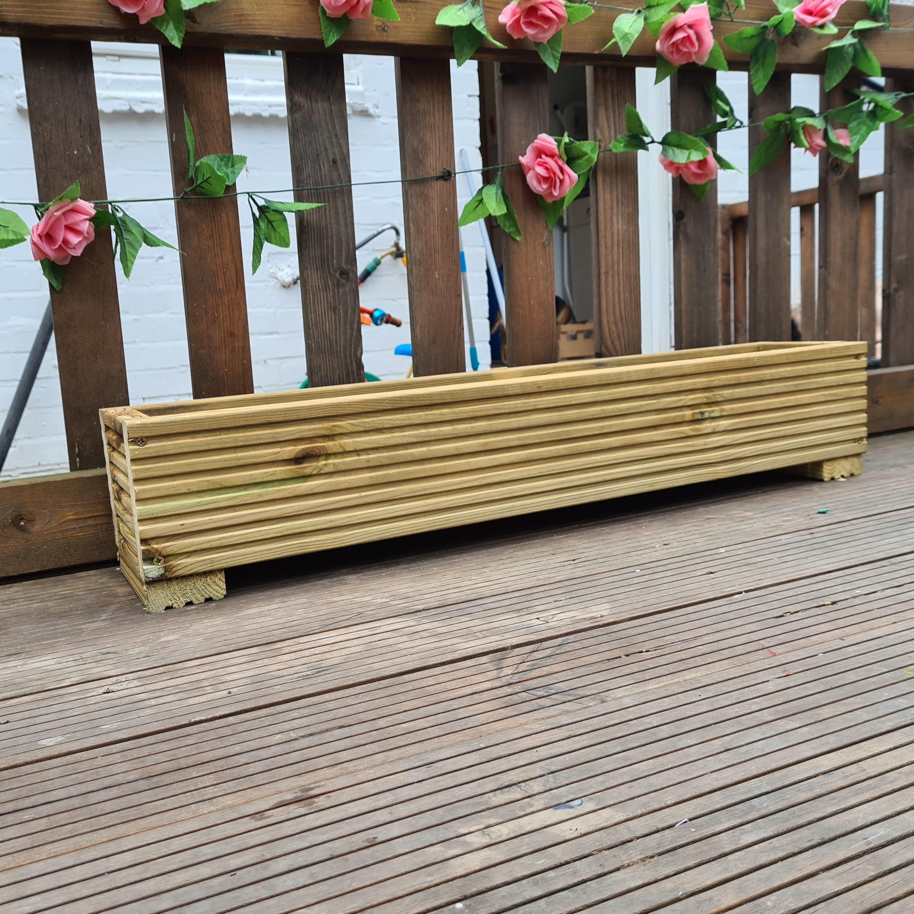 decking planter with picket fence in the background