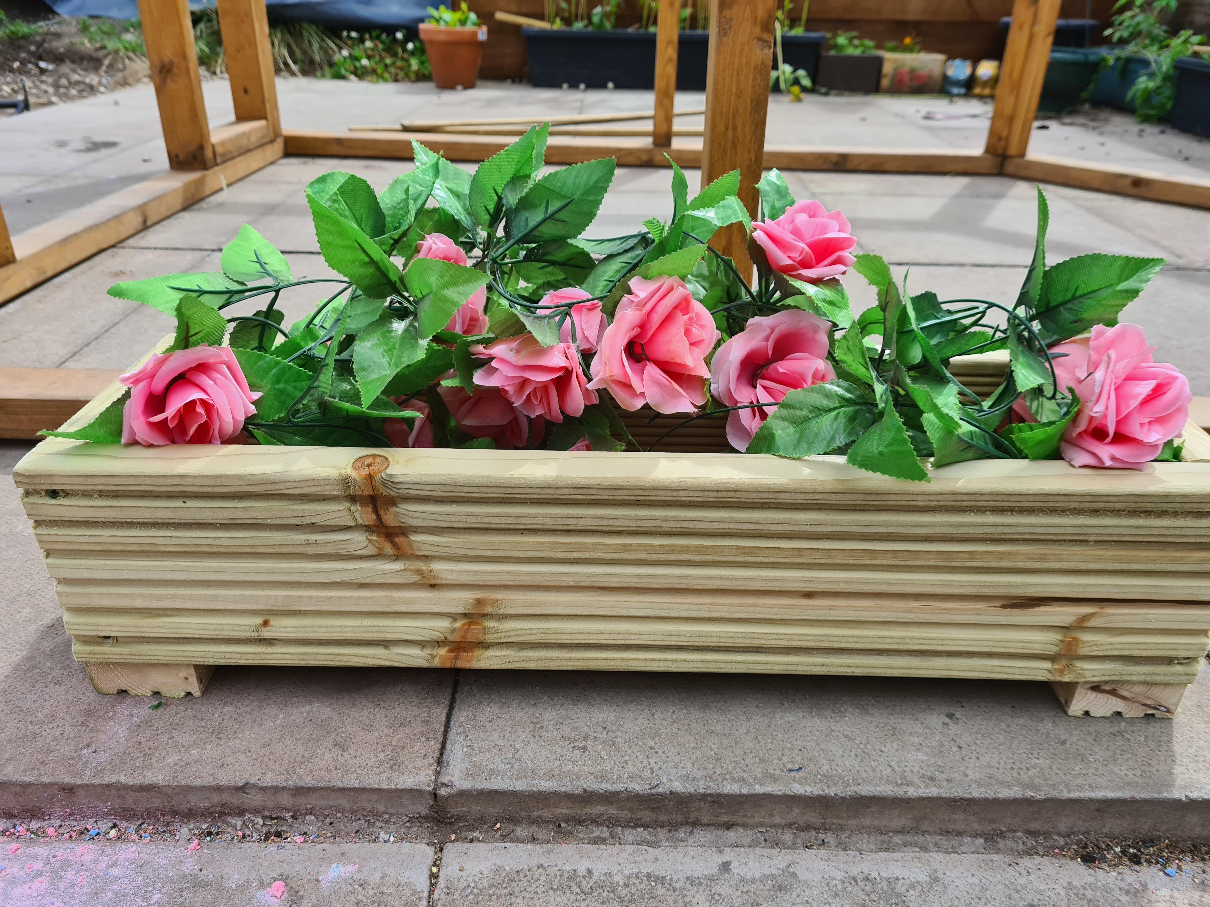 decking planter with fake flowers