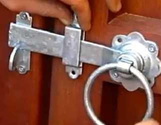 galvanized ring latch handle on a garden gate