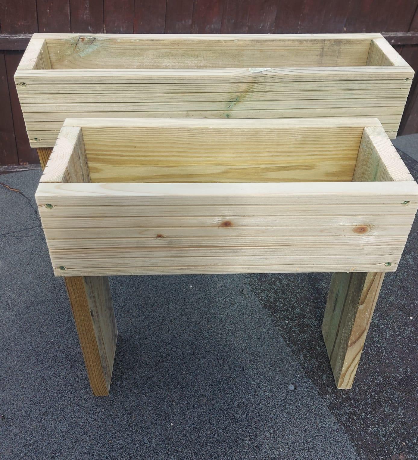 picture of 2 wooden decking planters with rained legs