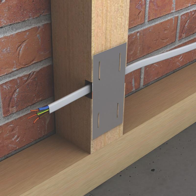 safe plate attached to wooden beam protecting wires