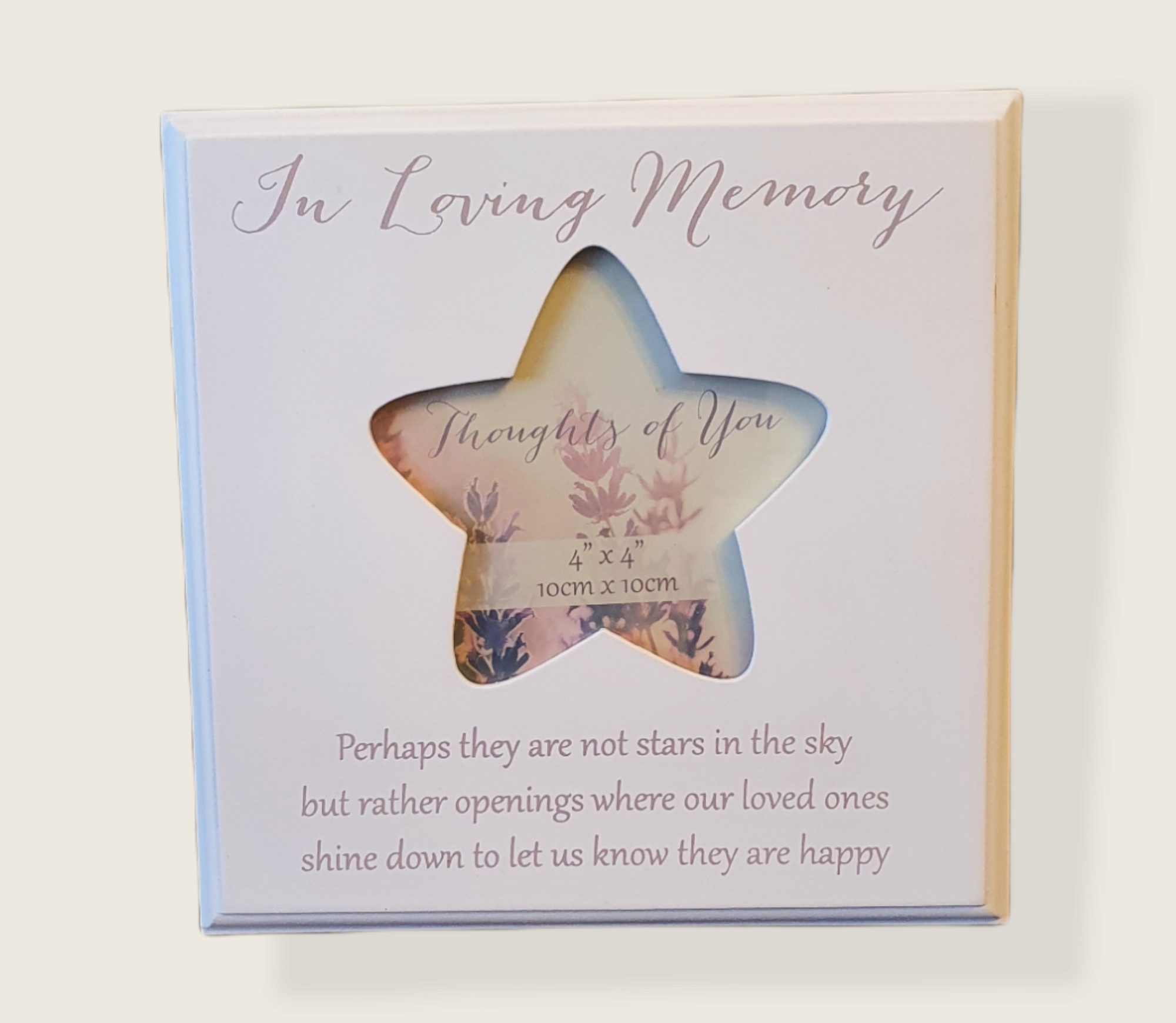 White wood square with a star cut out, Script  on frame that reads ' In Loving Memory Perhaps they are not stars in the sky, but rather openings where our loved ones shine down to let us know they are happy'.