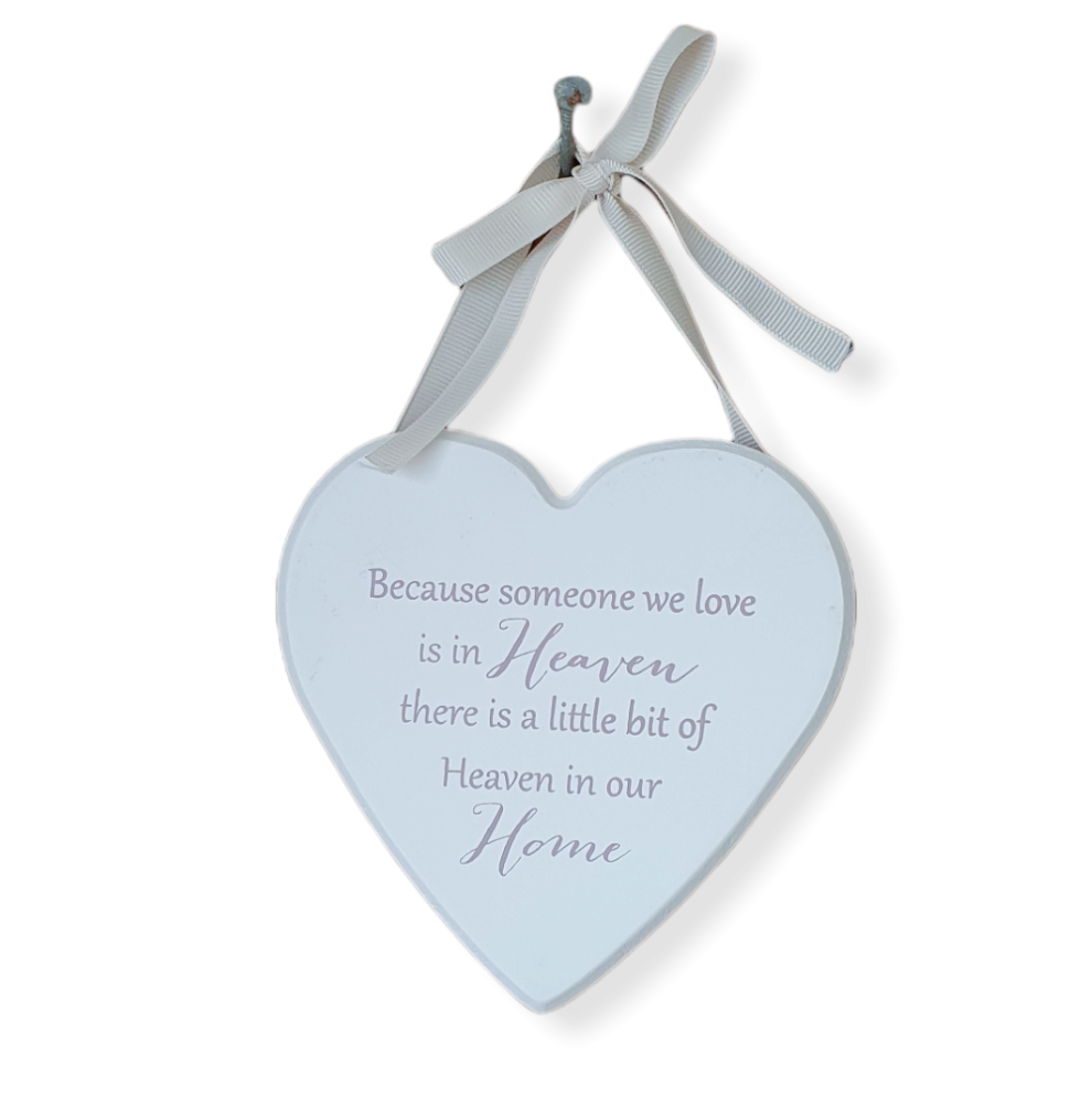White heart, Grey text 'Because someone we love is in heaven, there is a little bit of Heaven in our home' quote print. Light Grey Ribbon loop for hanging.