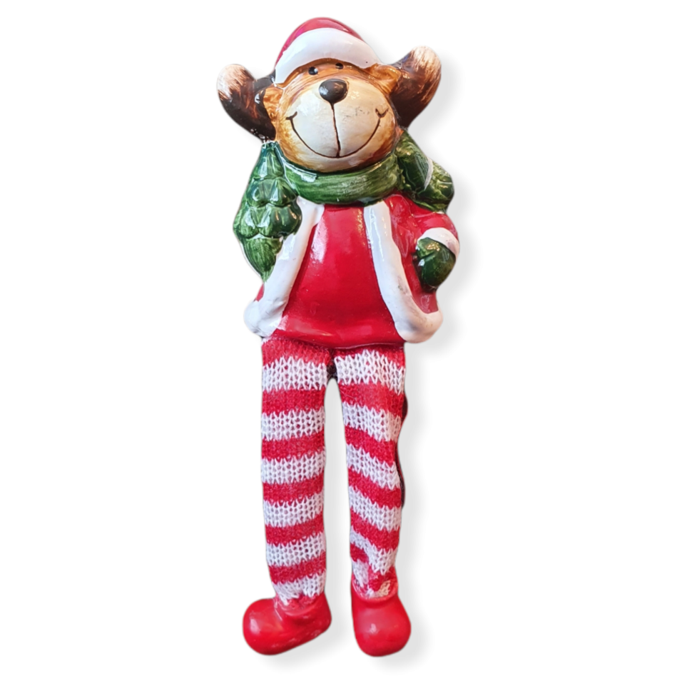 Sitting ceramic Reindeer with a Santa outfit on, green scarf, hanging red and white stripe cloth legs and ceramic red boots.