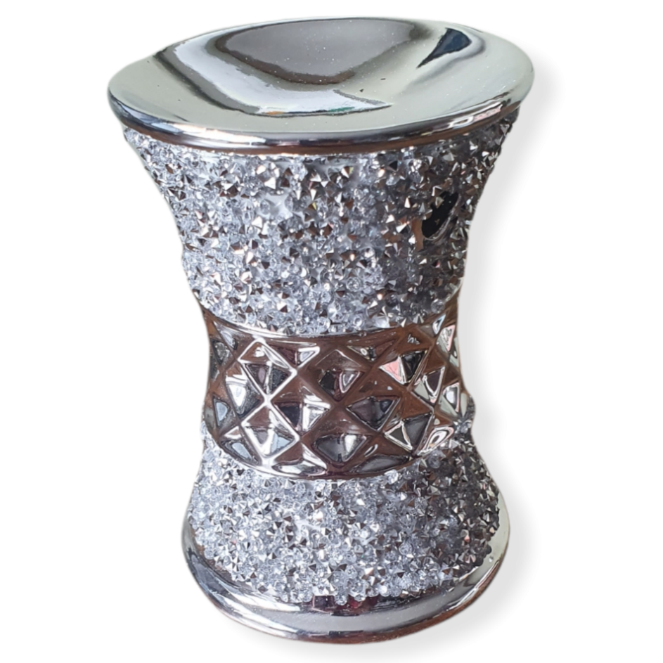 Sparkly silver cylinder shape standing wax burner with a diamond pattern through the middle.