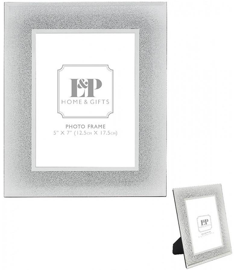 Vertical rectangle wide rimmed mirror and silver glitter photo frame.
