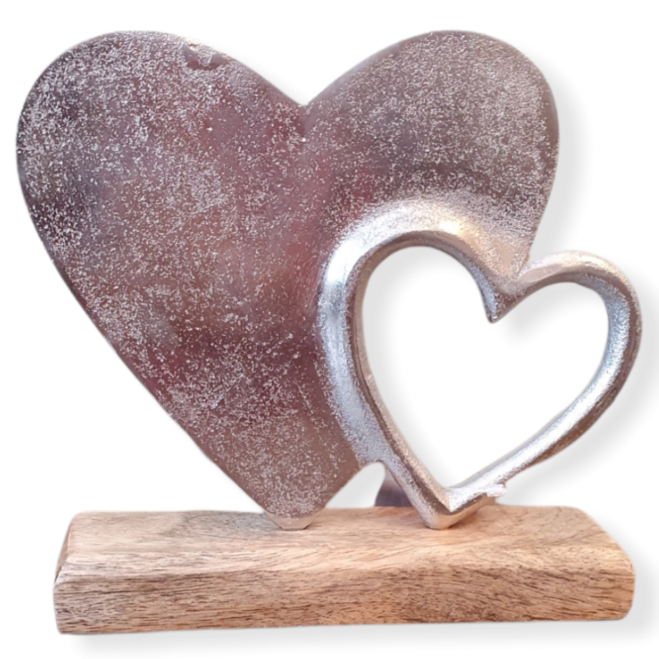 Rustic Metal Heart shape, hollow metal heart shape sitting just inside right side, both sitting on  wooden block base