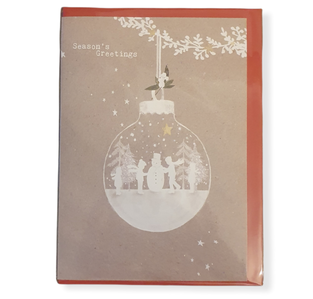Beige Card with a white hollow hanging bauble that has a snowy scene of children building a snowman inside it.