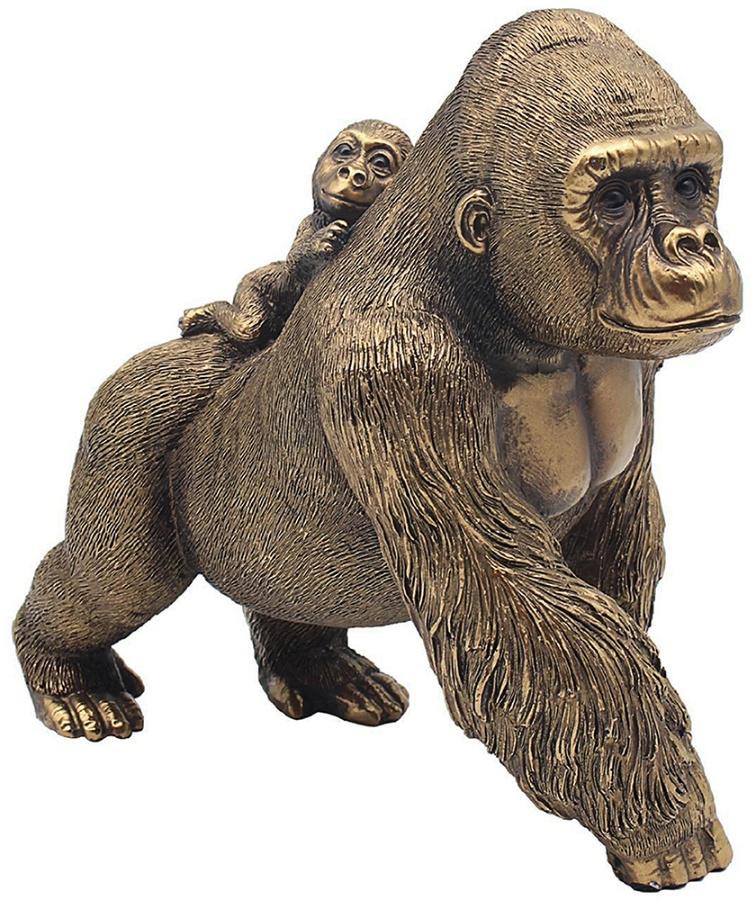 Bronze colour parent gorilla on all four legs, baby gorilla on parents back.