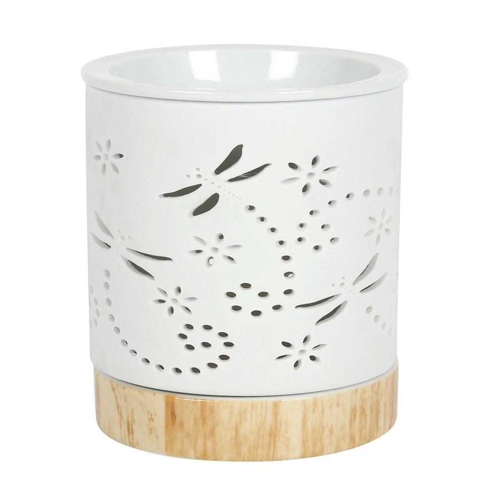 Matt white circular  ceramic dome wax warmer, dragon fly, flower and tiny circles cut out, light wood look ceramic base. Shiny white bowl top.