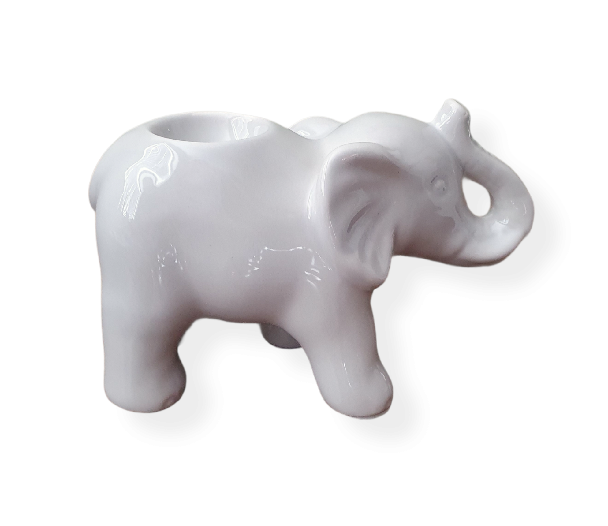 Light grey ceramic elephant facing the right, trunk up.