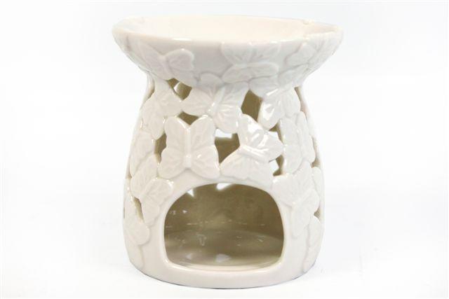 Cream coloured ceramic wax oil burner, butterflies wings touching pattern, tea light area.