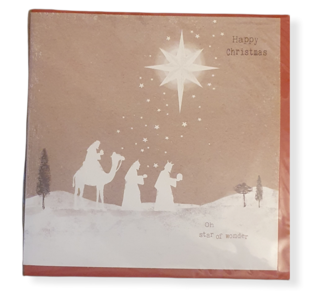 Light Brown card with white silhouette of wise men and a camel walking and the large star above them.