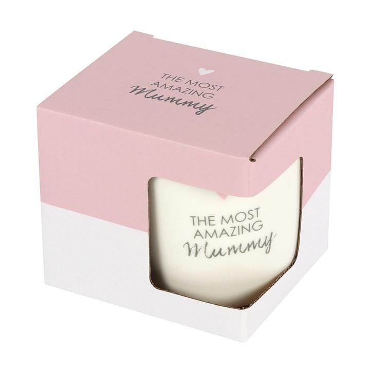 White ceramic mug with black script ' The most amazing mummy' in its outer pink box that has black  text  ' The most amazing Mummy' and a small pink heart.