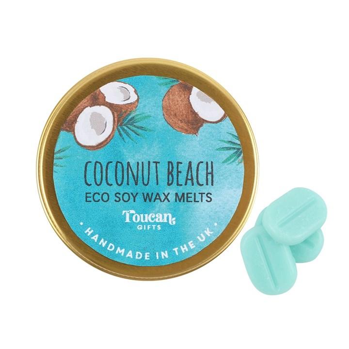 Circle gold tin with teal label black text, coconut halves and palm leaves on it.