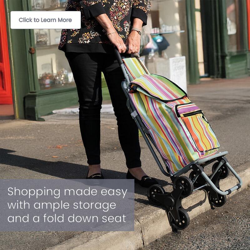 Lady using the stair climber version of the Lifemax Shopping Trolley to collect shopping on a UK high street