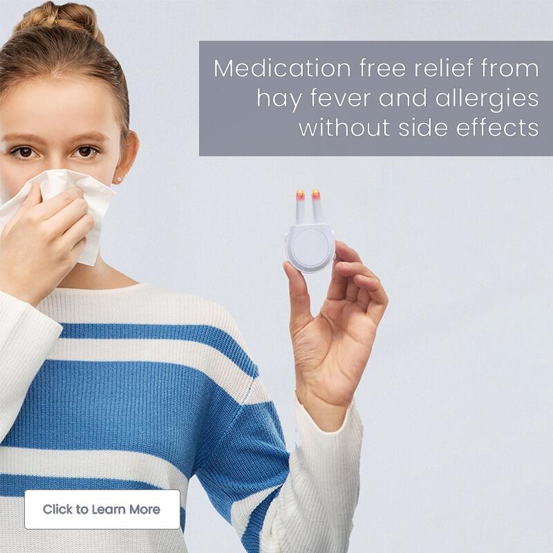 A young lady suffering from hay fever about to use the Lifemax Rechargeable Hay Fever and Allergy Reliever.  This reliever will help treat the symptoms of allergies and hay fever and help the lady to build up a resistance.